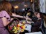 присуствующие в зале дамы получают букеты цветов от компании «Evrobuket Flower Delivery»-